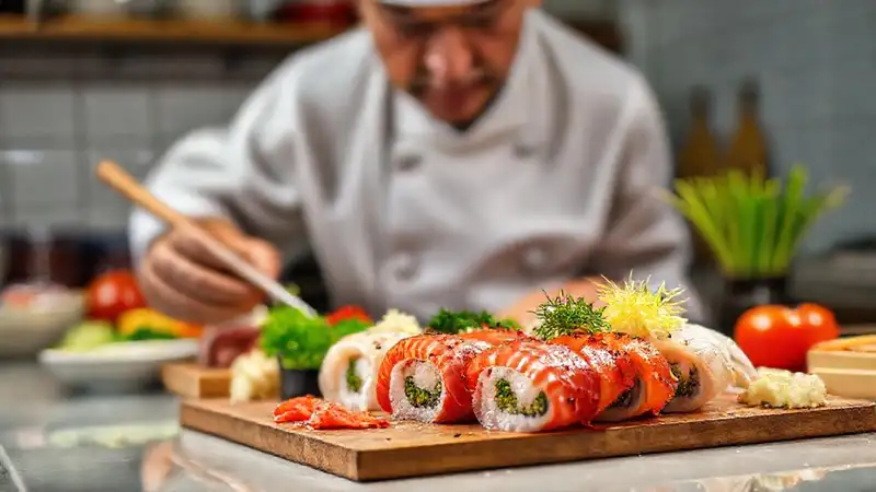 Heres the concise sentence:“A sushi chef’s vibrant artistry shines.”